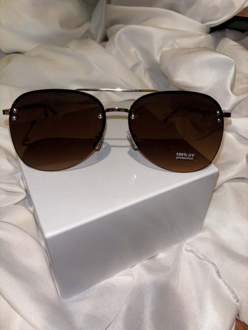 Ashley Stewart Rimless Aviator Sunglasses in Brown